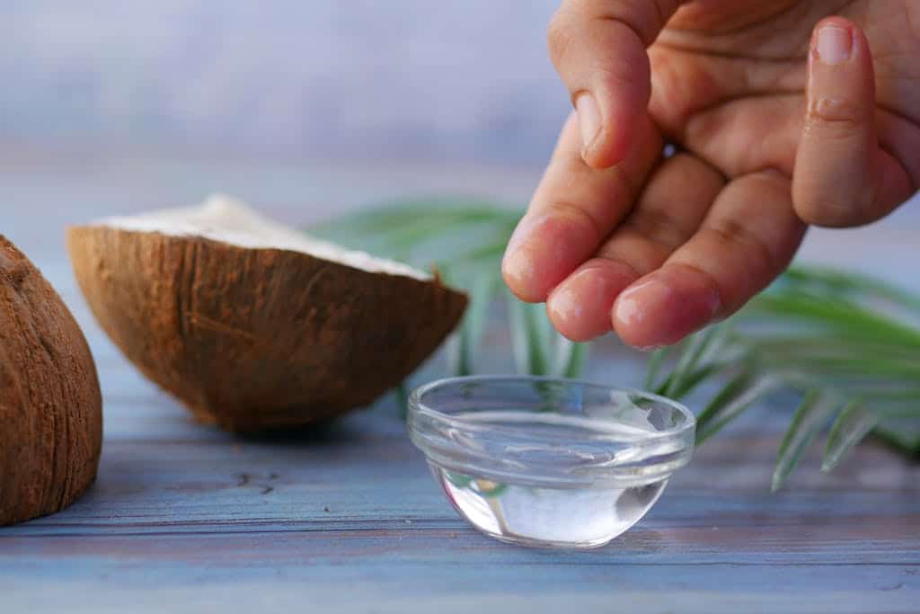 Natural ingredients for radiant skin. Clear Glass Bowl with White Liquid.