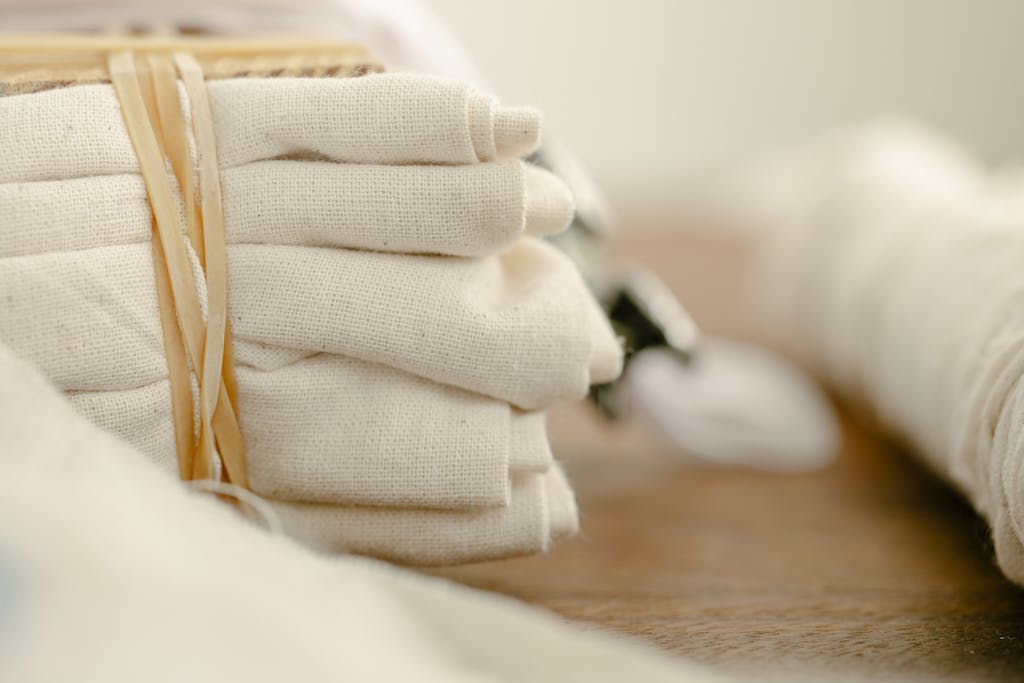 Tied pile of flax cloth on wooden table