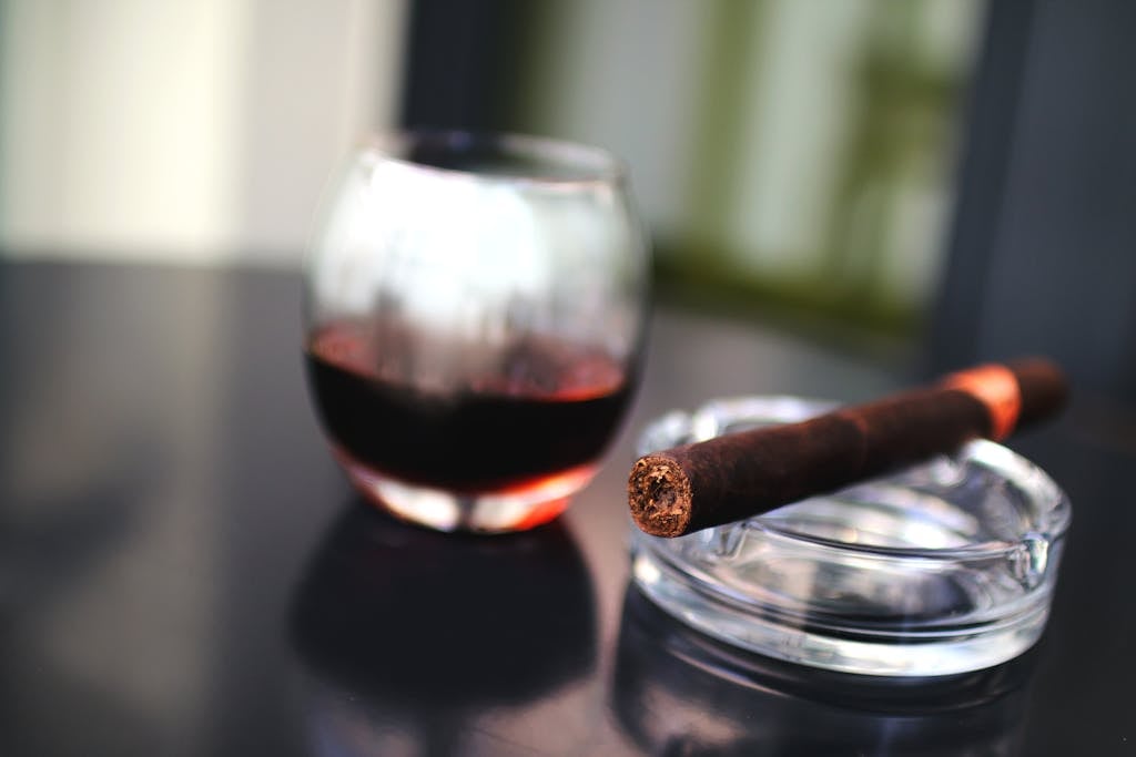 brown tobacco beside drinking glass 7403