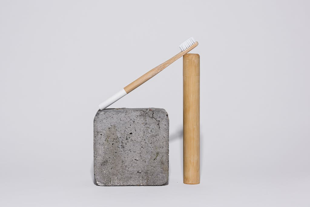 Bamboo Toothbrush on a Concrete Block