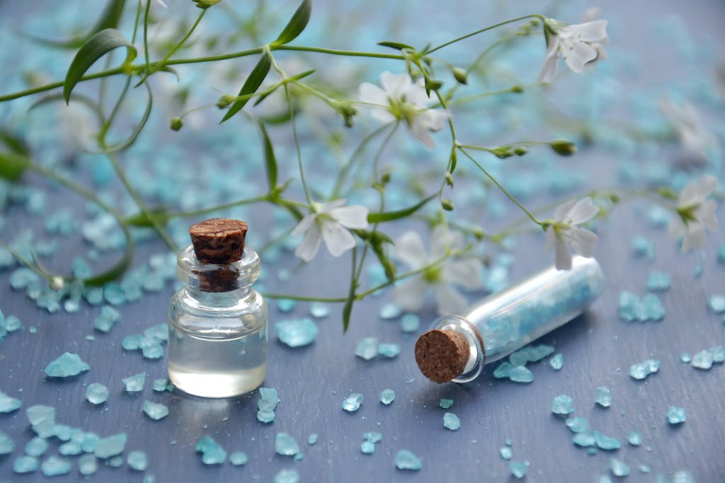 Two Clear Glass Bottles With Corks