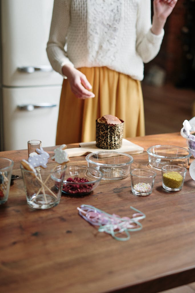 Decorating a Cake on Brown Wooden Table